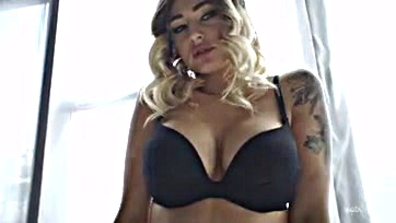 Foxy blonde flaunts black lingerie, teases with seductive charm