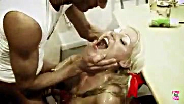 Blonde plays with cream, gets blowjob in kitchen