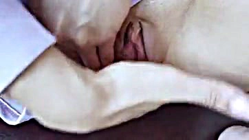 Woman exposes herself, playing with her moist vulva