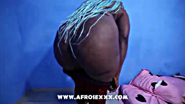 African woman flaunts large, curvy, and provocative buttocks