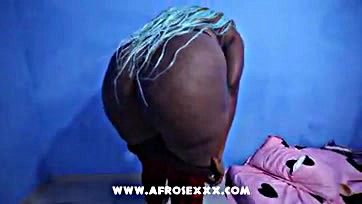 African woman flaunts large, curvy, and provocative buttocks