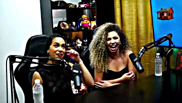 Two women expose their breasts and kiss on podcast