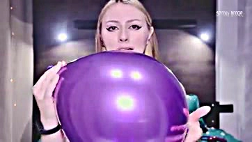 Brunette gets off on popping balloons, self-touching, and cumming