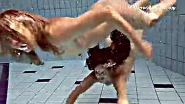 Lesbians get wet and wild in a steamy pool scene