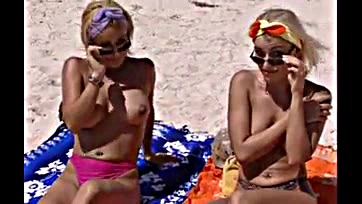 Judith and Monica engage in explicit beach activity