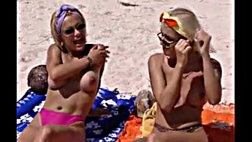 Judith and Monica engage in explicit beach activity