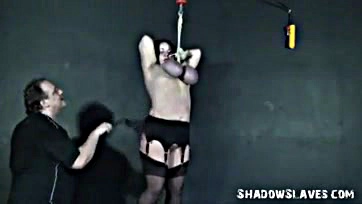 Man brutally whips and dominates submissive female slave