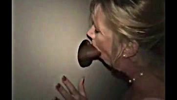 White wife sucks black cock at glory hole