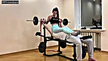 Femdom mistress dominates in gym, worshiping ass