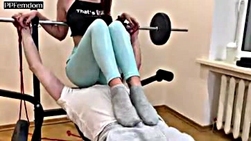 Femdom mistress dominates in gym, worshiping ass