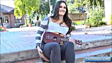 Teen flashes tits, strums uke in public