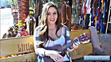 Teen flashes tits, strums uke in public