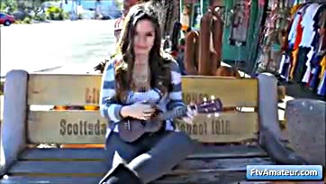 Teen flashes tits, strums uke in public