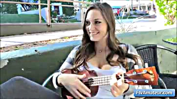 Teen flashes tits, strums uke in public