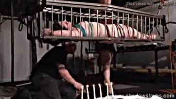 Lesbian BDSM action features caged American fetish model