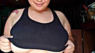 A Latina teen exposes her large breasts on camera