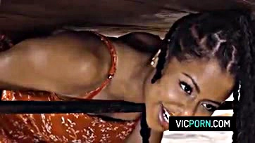 Black woman Kira Noir receives anal sex under table