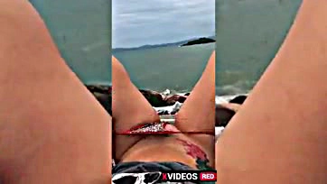 Girl publicly plays with dildo in explicit manner