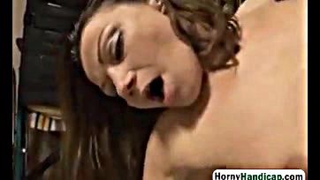 Brunette slut rides handicapped guy's dick hard