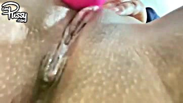 Woman uses vibrator on her own pubic area