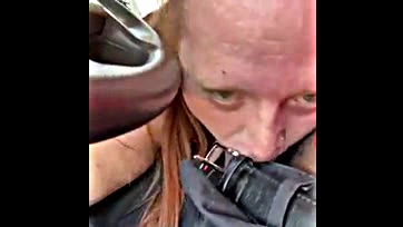 Man gets oral sex from fat redhead while driving truck