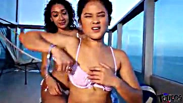 Young Latina and Filipina teens engage in a threesome