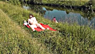 Sexy MILF sunbathes naked, gets joined by random dude