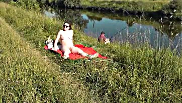 Sexy MILF sunbathes naked, gets joined by random dude