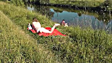 Sexy MILF sunbathes naked, gets joined by random dude