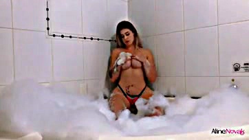 Young blonde girl gets pleasured in the bathtub