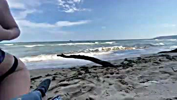 Teen girl gets cummed on at public beach