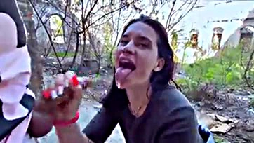 Public oral sex with cum in a crowded outdoor setting