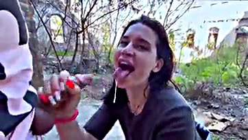 Public oral sex with cum in a crowded outdoor setting