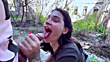 Public oral sex with cum in a crowded outdoor setting