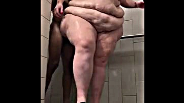 Redhead BBW gets banged in a truck stop shower