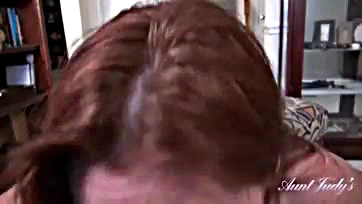 A 48-year-old redhead sucks cock in POV