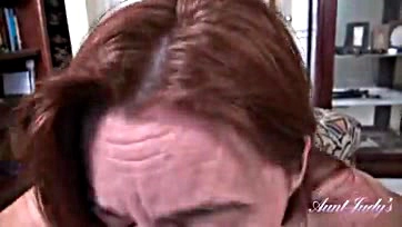 A 48-year-old redhead sucks cock in POV