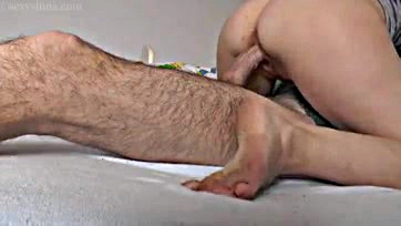 Sexy milf teases partner's cock with foot play