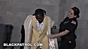 Two female officers rough up a black pimp