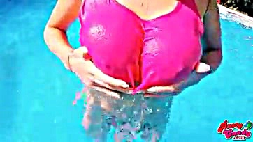 Big-boobed blonde teen flaunts her massive tits at pool