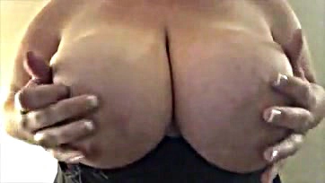 A French woman teases her large breasts