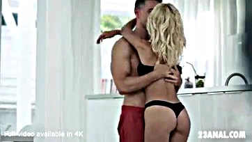 Explicit sex scene featuring blonde and leather attire