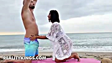 A woman gets a beach hookup with a stranger