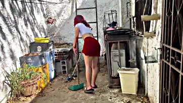 She's hot while cleaning the patio in a skirt