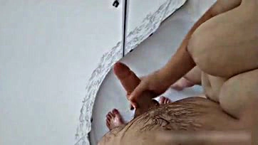 Stepmom jacks off stepson's cock in the shower