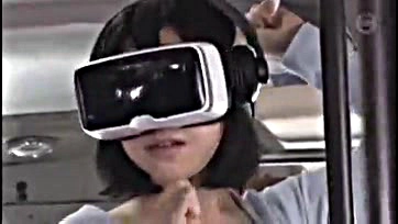 Asian woman caught in bus with VR glasses