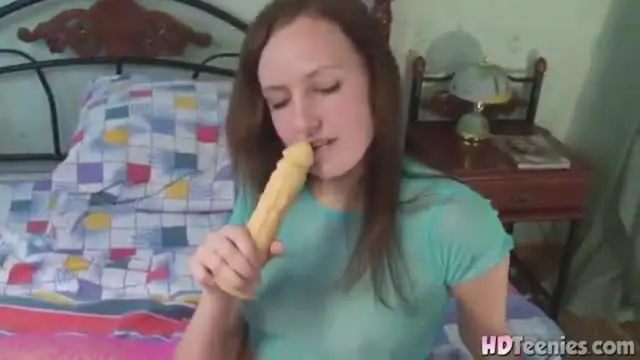 Hot Brunette with natural titrs Sucking Dildo