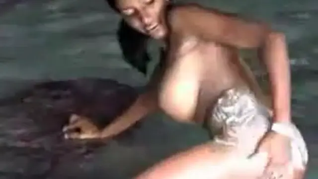 A busty young Latina sucks dick at the beach 