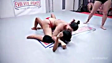 Lesbians wrestle, then engage in intense strap-on sex