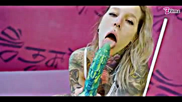 Explicit hardcore sex scene with tattooed girl and toys